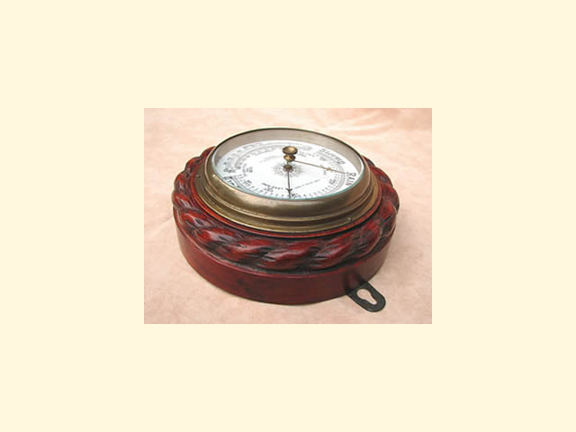 Victorian barometer with curved thermometer, in ropetwist carved oak surround